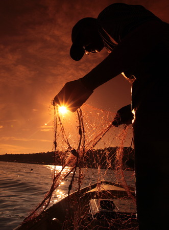 A fisherman in the water landscape around the capital Bandar Seri Begawan in Brunei Darussalam Kingdom on Borneo in South East Asiaのeditorial素材