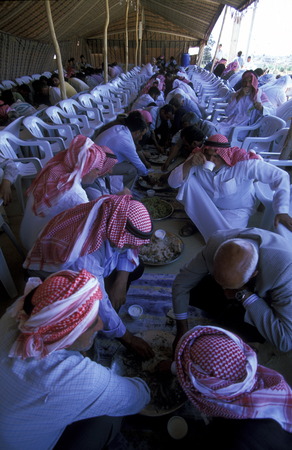 Syrian Einwohener while eating at a wedding feast in the historic center of the town Bosra in the south of Syria in the Middle Eastのeditorial素材