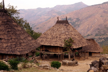 A traditional house in the mountain village of Maubisse south of Dili in East Timor on the island of Timor separated into two in Asiaの写真素材