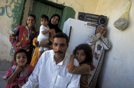 A family man with two women in Tesrin village between Aleppo and the border zom Iraq on the Euphrates River in northern Syria in the Middle Eastのeditorial素材