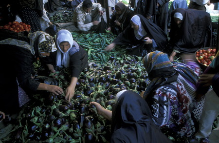 Women in the vegetable market on the Souq or market in the medina of the old city of Aleppo in northern Syria in the Middle Eastのeditorial素材