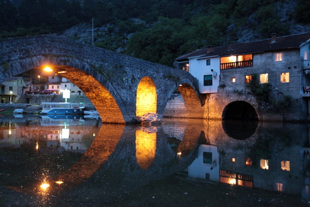 The landscape with the stone bridge from Rijeka Rijeka crnojevica crnojevica with the river at the western end of the Skadar Lake Skadar Jezero lake or in central Montenegro in Montenegro in the Balkans, the Mediterranean Sea in Europeの写真素材