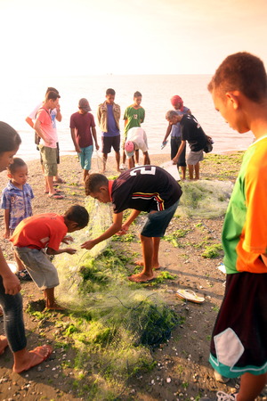 Fishermen on the beach city of Dili the capital of East Timor on the island of Timor separated into two in Asiaのeditorial素材