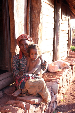 Asia, Southeast Asia, East Timor, Timor-Leste, Timor, Maubisse, Mountain Region, minorities, home, life, children, a grandmother with child in a mountain village in Maubisse in the mountain region in East Timor in Southeast Asia Urs FlÃ¼elerのeditorial素材