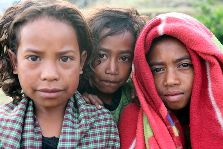 Children in a farming village in the mountain village of Maubisse south of Dili in East Timor on the island of Timor separated into two in Asiaのeditorial素材