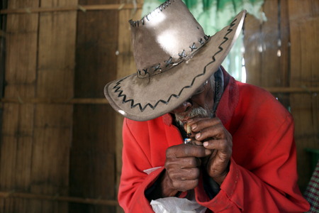 A farmer in front of his house in a farming village in the mountain village of Maubisse south of Dili in East Timor on the island of Timor separated into two in Asiaのeditorial素材