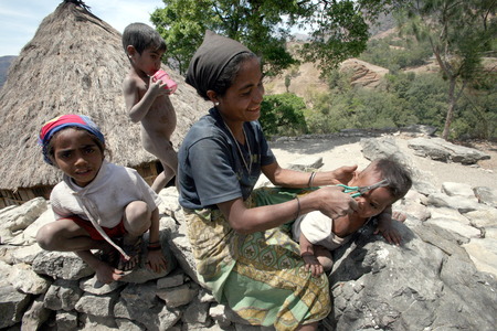 Children in a peasant family in the mountain village of Maubisse south of Dili in East Timor on the island of Timor separated into two in Asia in a farming villageのeditorial素材
