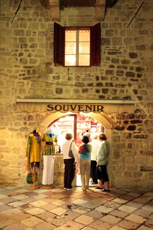 The old town of Kotor with a souvenir shop in the inner Bay of Kotor in Montenegro in the Balkans, the Mediterranean Sea in Europeのeditorial素材