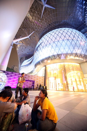 The entrance to the ION Orchard shopping center on Orchard Road in Singapore in the island state of Singapore in Asiaのeditorial素材