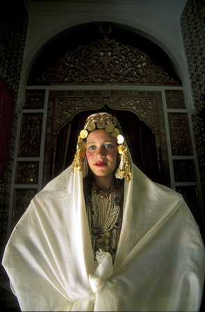 A woman in traditional wedding attire in Mahdia on the Mediterranean Sea in north-eastern Tunisia in North Africaのeditorial素材
