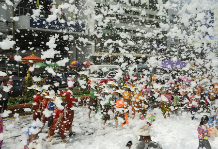 The Songkran festival or Thai New Year water festival to be in full swing north of Bangkok in Ayutthaya Thailand in Southeast Asiaのeditorial素材