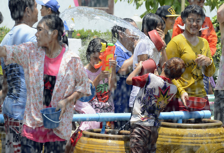 The Songkran festival or Thai New Year water festival to is in full swing north of Bangkok in Ayutthaya Thailand in Southeast Asiaのeditorial素材