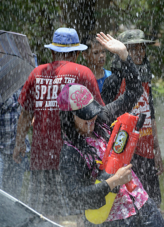 The Songkran festival or Thai New Year water festival to be in full swing north of Bangkok in Ayutthaya Thailand in Southeast Asiaのeditorial素材