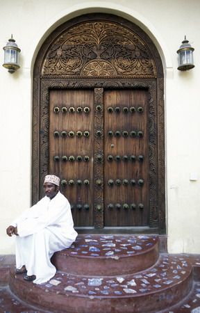 A wooden door in the old town in Stone Town the capital of the island of Zanzibar in the Indian Ocean in Tanzania in Africaのeditorial素材