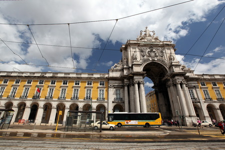 A bus on the Praca do Comercio in the downtown area of ââthe capital city of Lisbon in Portugalのeditorial素材