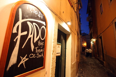 One of several Fado bars with live fado music and good food in the neighborhood Alfama, the old town of Lisbon in Portugalのeditorial素材