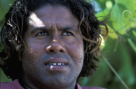 A man on the local island Dhangethi close to Meeru Island in the North Male Atoll in the islands of the Maldives in the Indian Oceanのeditorial素材