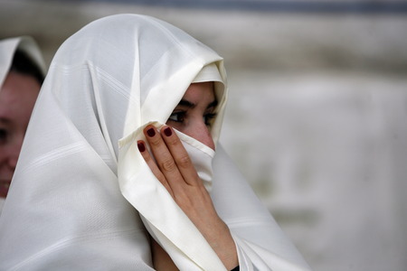 A Young Tunisian woman in the old town of Sidi Bou Said on the Mediterranean Sea north of Tunis in Tunisia in North Africaのeditorial素材