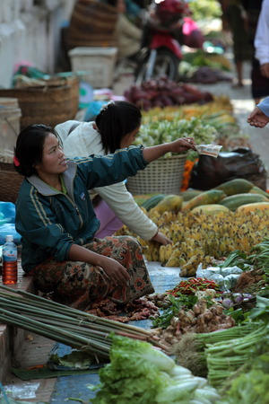 At the market in the old town of Luang Prabang in Laos of Central Laos in South East Asiaのeditorial素材