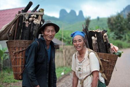 People in the countryside in the mountain region near the village of Kasi at the national highway 13 between Vang Vieng and Luang Prabang in Laos of Central Laos in South East Asiaのeditorial素材