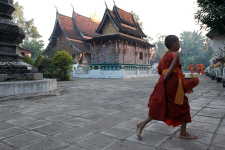 Monks in the temple Xieng Thong in the old town of Luang Prabang in Laos of Central Laos in South East Asiaのeditorial素材