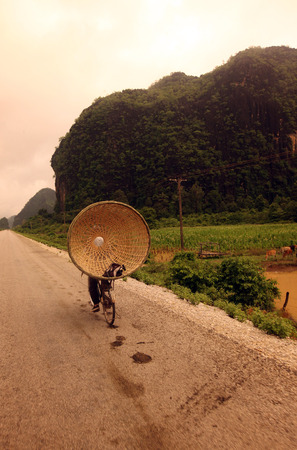 The landscape on the Xe Bang Fai River near the village of Tham Pa Fa Mahaxai May from near the town of Tha Khaek in central Laos on the border with Thailand in Southeast Asiaのeditorial素材