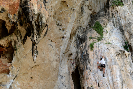 a Climber at the rocks of the Hat Phra Nang Beach at Railay near Ao Nang outside of the City of Krabi on the Andaman Sea in the south of Thailand. のeditorial素材