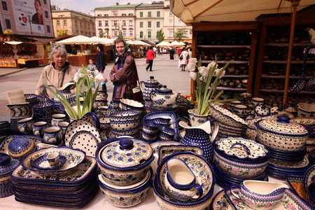 A market stall with ceramic on the Rynek Glowny Square in the Old Town of Krakow in sueden of Poland.のeditorial素材