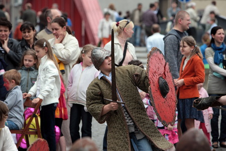Children in a medieval game at a party in the center of Poznan in the west of Poland.のeditorial素材