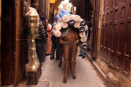 a smal Market Road in the medina of old City in the historical town of Fes in Morocco in north Africa.のeditorial素材