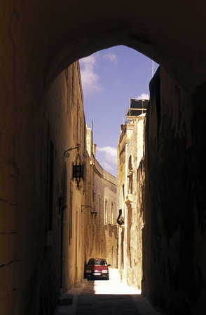 A smal road in the centre of the Old Town of the city of Valletta on the Island of Malta in the Mediterranean Sea in Europe.のeditorial素材