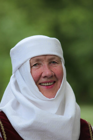 a Women in traditional dress on a Summer Festival in a Parc in the old City of Vilnius in the Baltic...