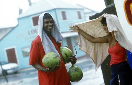 people go shoping bevor a tropical storm in the town of  St Gilles les Bains  on the Island of La Reunion in the Indian Ocean in Africa.のeditorial素材