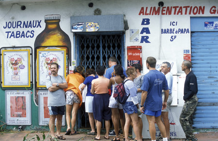 people go shoping bevor a tropical storm in the town of  St Gilles les Bains  on the Island of La Reunion in the Indian Ocean in Africa.のeditorial素材