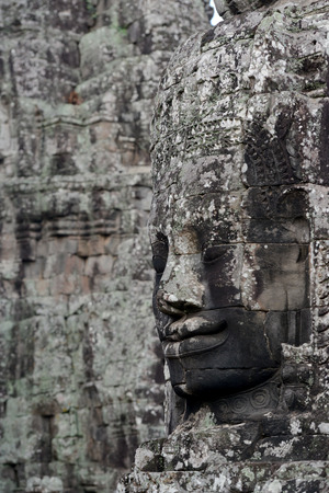 Stone Faces the temple ruin of Angkor Thom in the Temple City of Angkor near the City of Siem Reap in the west of Cambodia.のeditorial素材