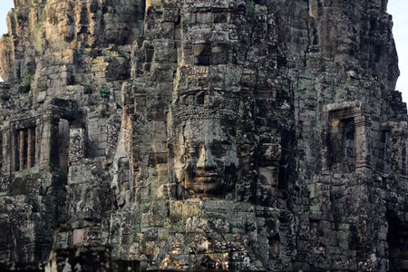 Stone Faces the temple ruin of Angkor Thom in the Temple City of Angkor near the City of Siem Reap in the west of Cambodia.のeditorial素材