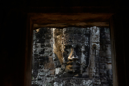 Stone Faces the Tempel Ruin of Angkor Thom in the Temple City of Angkor near the City of Siem Riep in the west of Cambodia.のeditorial素材