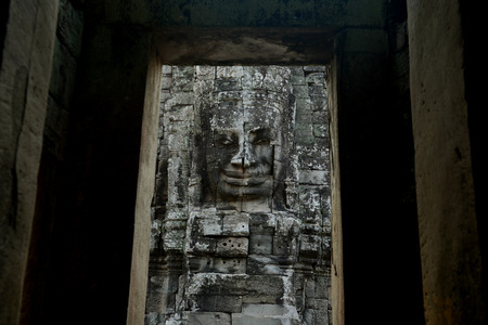 Stone Faces the Tempel Ruin of Angkor Thom in the Temple City of Angkor near the City of Siem Riep in the west of Cambodia.のeditorial素材