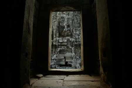 Stone Faces the Tempel Ruin of Angkor Thom in the Temple City of Angkor near the City of Siem Riep in the west of Cambodia.のeditorial素材