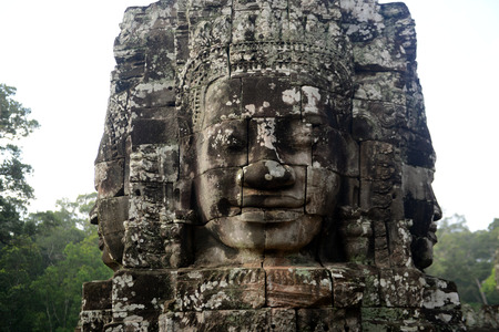 Stone Faces the Tempel Ruin of Angkor Thom in the Temple City of Angkor near the City of Siem Riep in the west of Cambodia.のeditorial素材