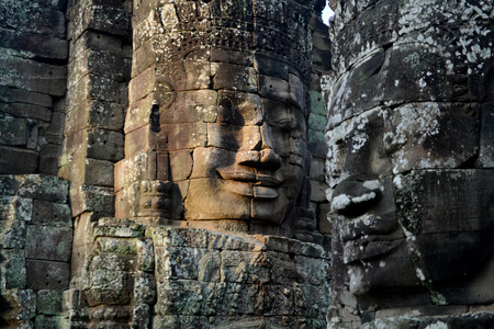 Stone Faces the Tempel Ruin of Angkor Thom in the Temple City of Angkor near the City of Siem Riep in the west of Cambodia.のeditorial素材