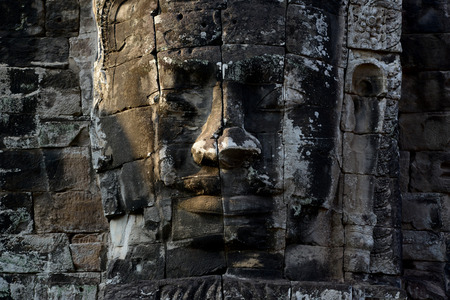 Stone Faces the Tempel Ruin of Angkor Thom in the Temple City of Angkor near the City of Siem Riep in the west of Cambodia.のeditorial素材