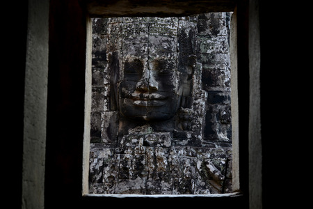Stone Faces the Tempel Ruin of Angkor Thom in the Temple City of Angkor near the City of Siem Riep in the west of Cambodia.のeditorial素材