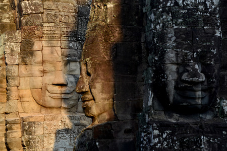 Stone Faces the Tempel Ruin of Angkor Thom in the Temple City of Angkor near the City of Siem Riep in the west of Cambodia.のeditorial素材