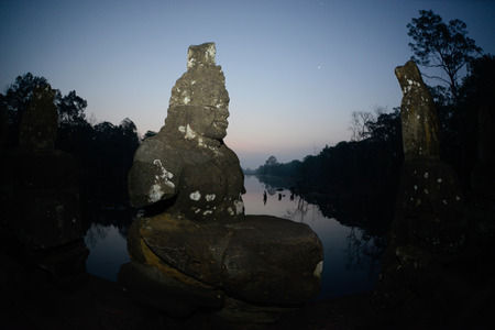 The Bridge at the Angkor Tom Gate in the Temple City of Angkor near the City of Siem Riep in the west of Cambodia.のeditorial素材