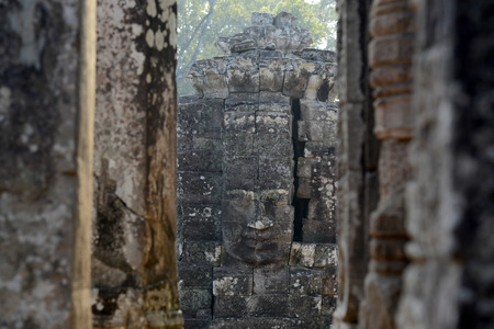 Stone Faces the Tempel Ruin of Angkor Thom in the Temple City of Angkor near the City of Siem Riep in the west of Cambodia.のeditorial素材
