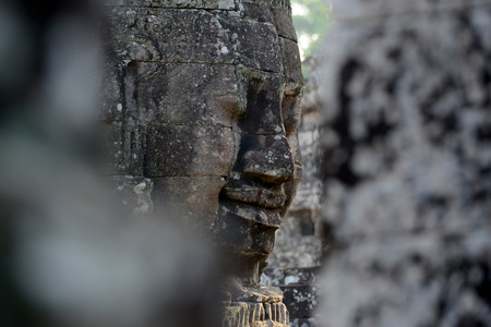 Stone Faces the Tempel Ruin of Angkor Thom in the Temple City of Angkor near the City of Siem Riep in the west of Cambodia.のeditorial素材