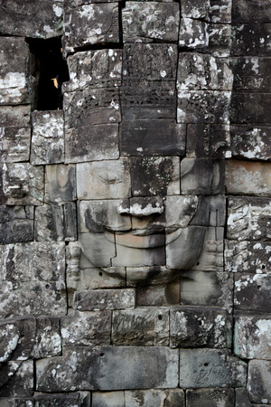 Stone Faces the Tempel Ruin of Angkor Thom in the Temple City of Angkor near the City of Siem Riep in the west of Cambodia.のeditorial素材