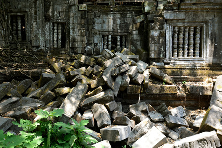 Stone Faces the Tempel Ruin of Angkor Thom in the Temple City of Angkor near the City of Siem Riep in the west of Cambodia.のeditorial素材