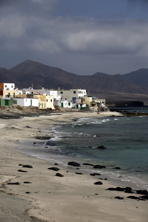The Fishing Village of  Puertito de la Cruz on the coast in the Jandia Natural Parc on the south of the Island Fuerteventura on the Canary island of Spain in the Atlantic Ocean.のeditorial素材